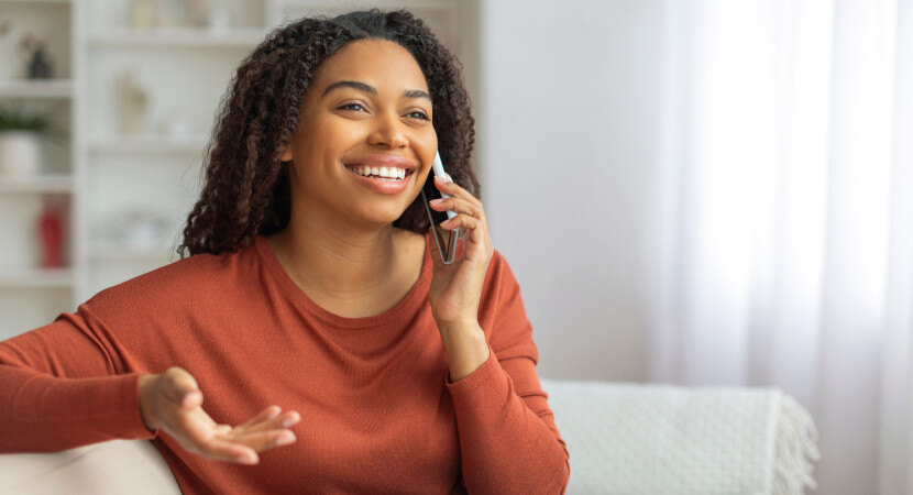 happy-woman-on-phone-830x450