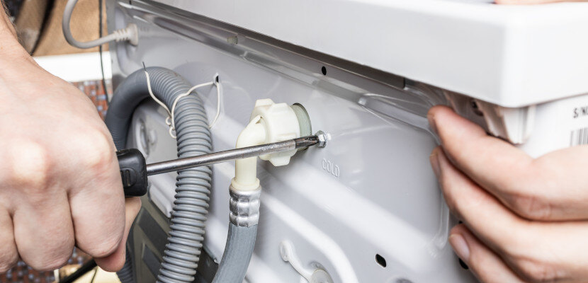 repairperson-fixing-appliance-830x400